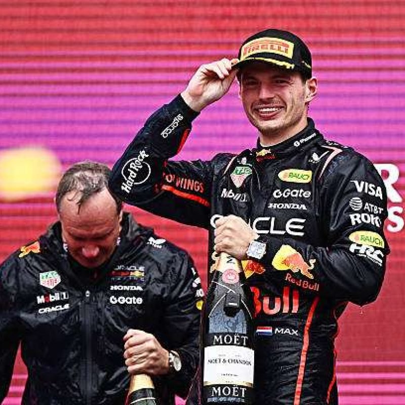 BAKU, AZERBAIJAN - SEPTEMBER 21: Race winner Max Verstappen of the Netherlands and Oracle Red Bull Racing and Paul Monaghan, Head of Car Engineering of Oracle Red Bull Racing celebrate on the podium during the F1 Grand Prix of Azerbaijan at Baku City Circuit on September 21, 2025 in Baku, Azerbaijan. (Photo by Pauline Ballet/LAT Images)
